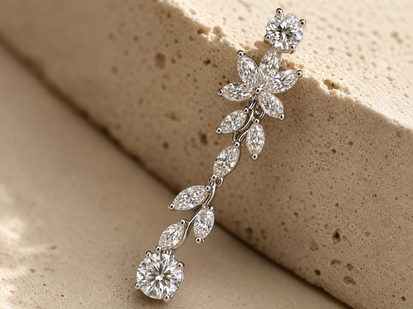 Macro detail of the RW floral vine drop earring showing the marquise petal flower and graduated marquise vine
